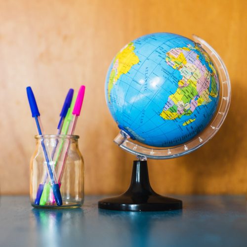 jar-with-pens-near-globe